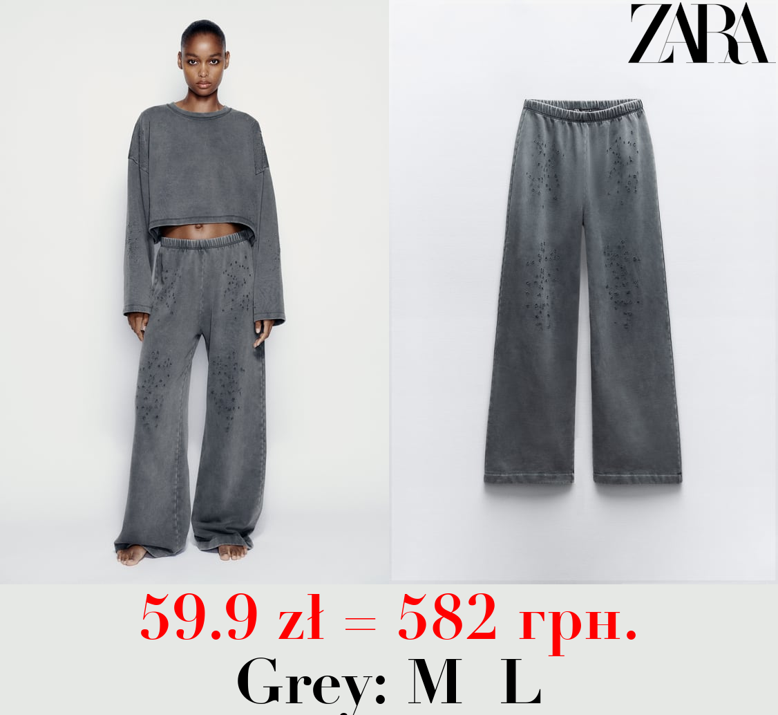 FADED-EFFECT RIPPED PLUSH TROUSERS