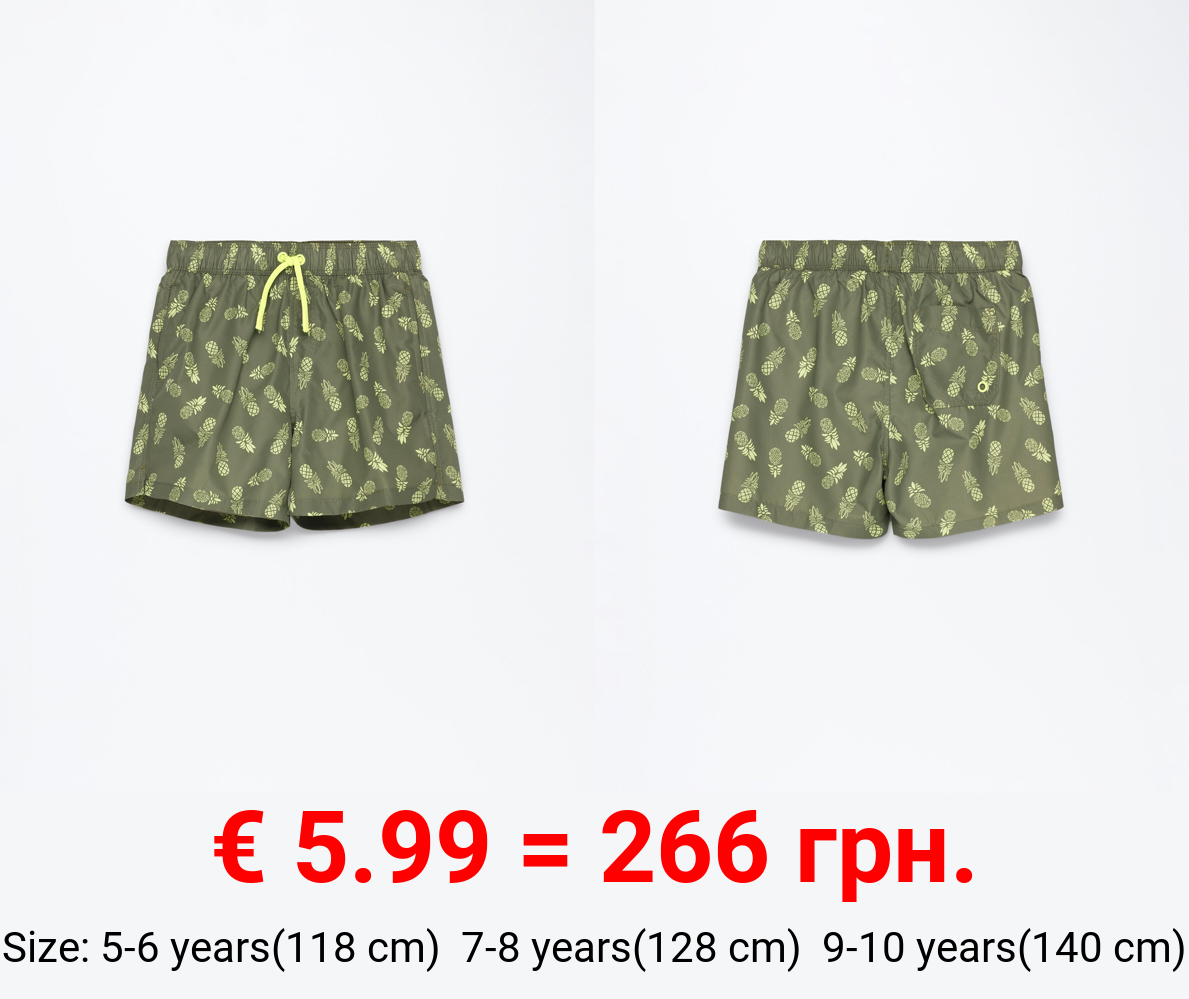 Tropical print swimming trunks