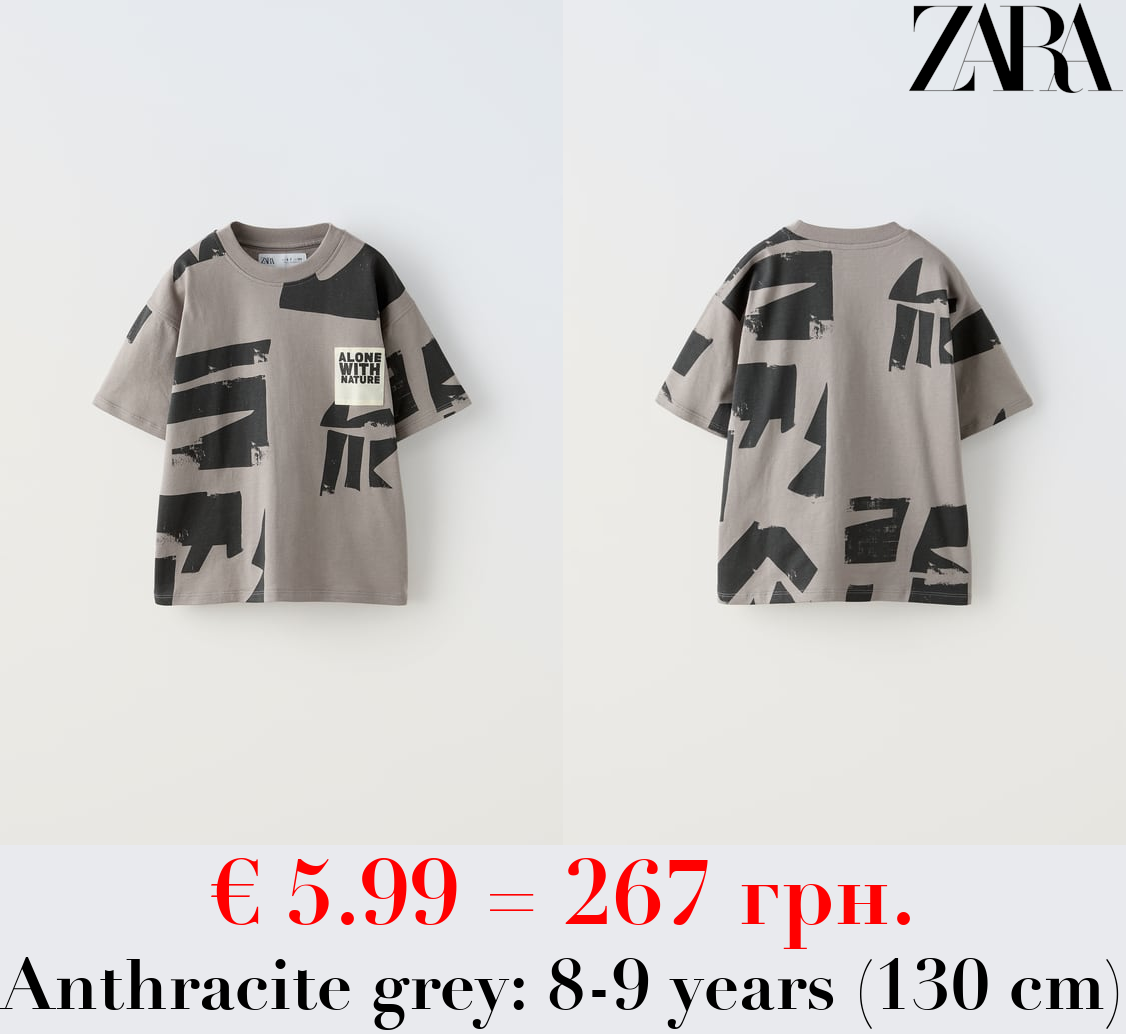 T-SHIRT WITH TAG APPLIQUÉ