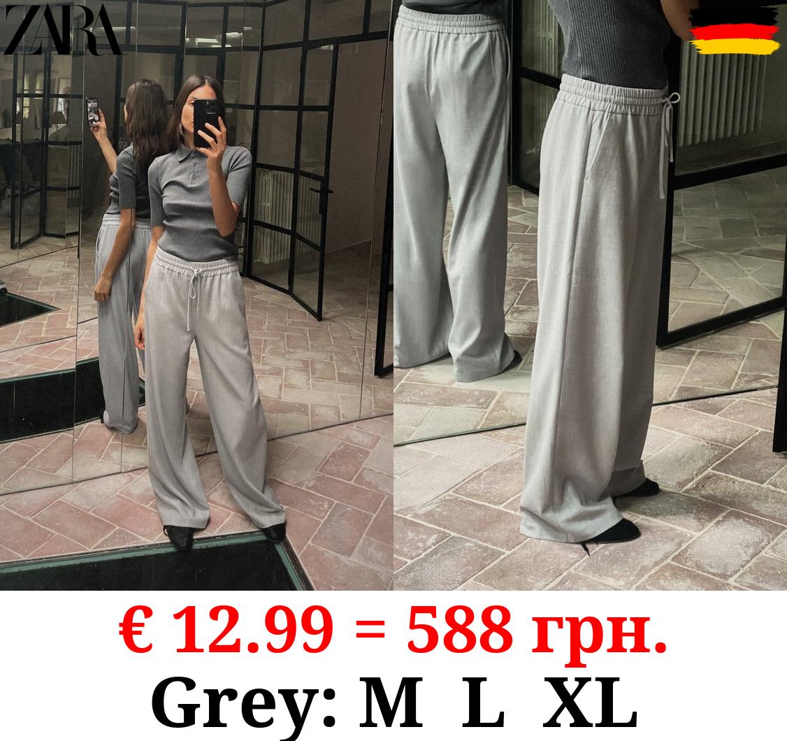 TROUSERS WITH AN ELASTICATED WAISTBAND