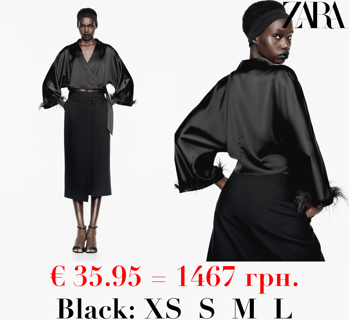 TOP WITH FEATHER TRIM ON SLEEVES