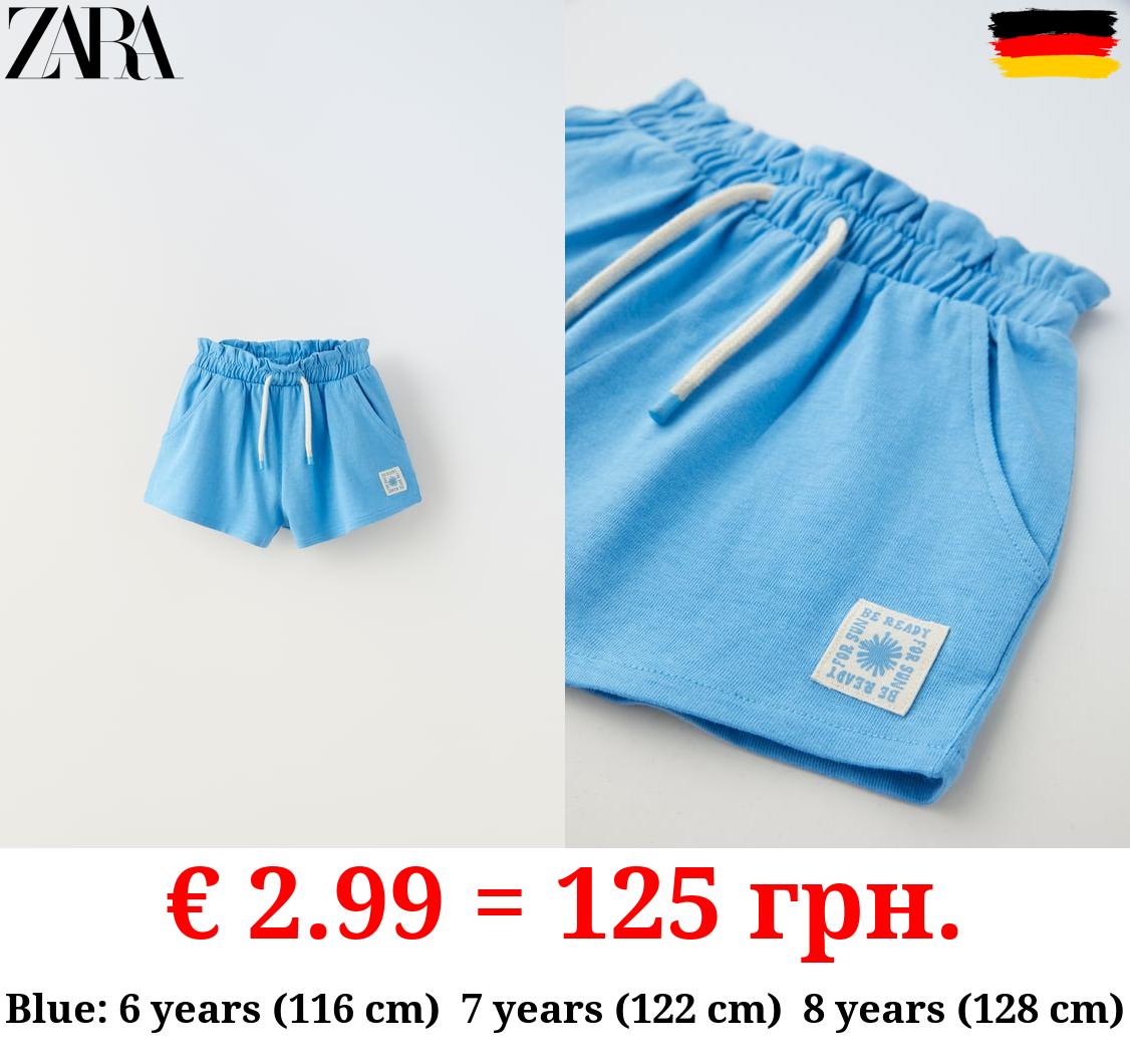PLUSH BERMUDA SHORTS WITH LABEL DETAIL