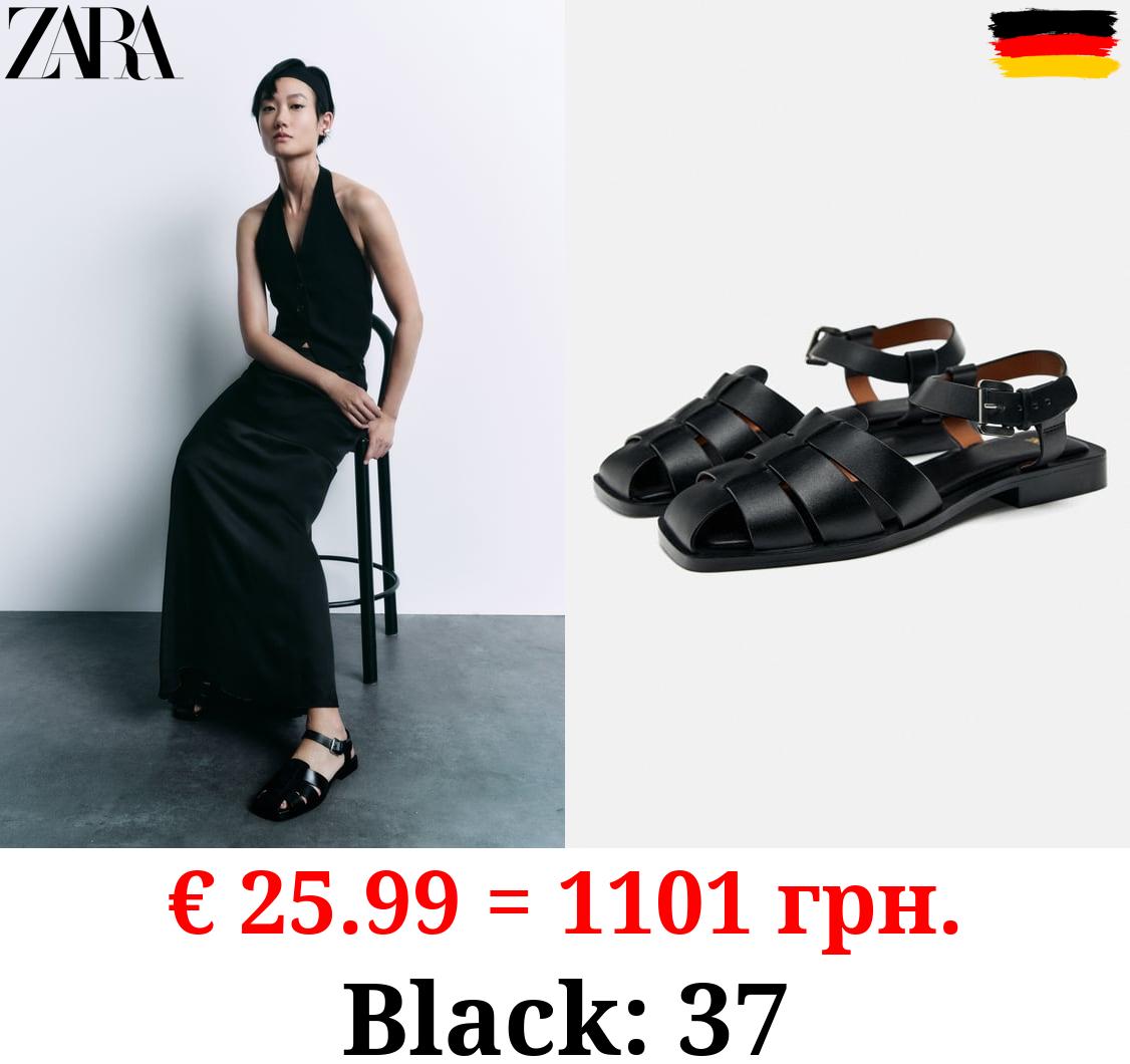 FLAT LEATHER CAGE SANDALS