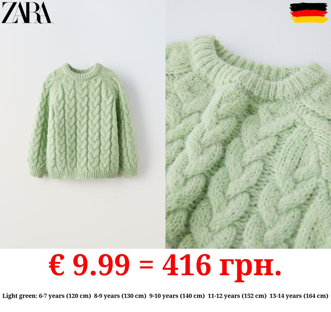 CABLE-KNIT SWEATER