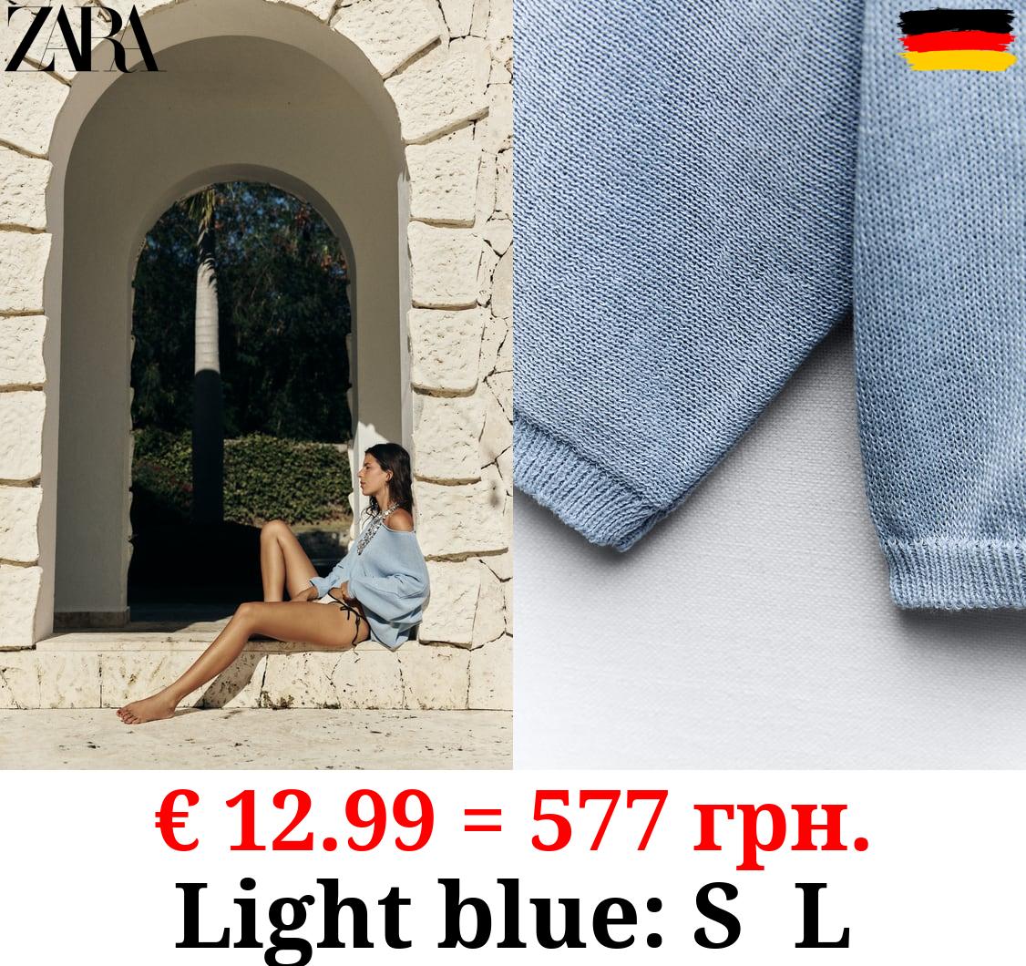 PLAIN KNIT SWEATER WITH CENTRAL SEAM