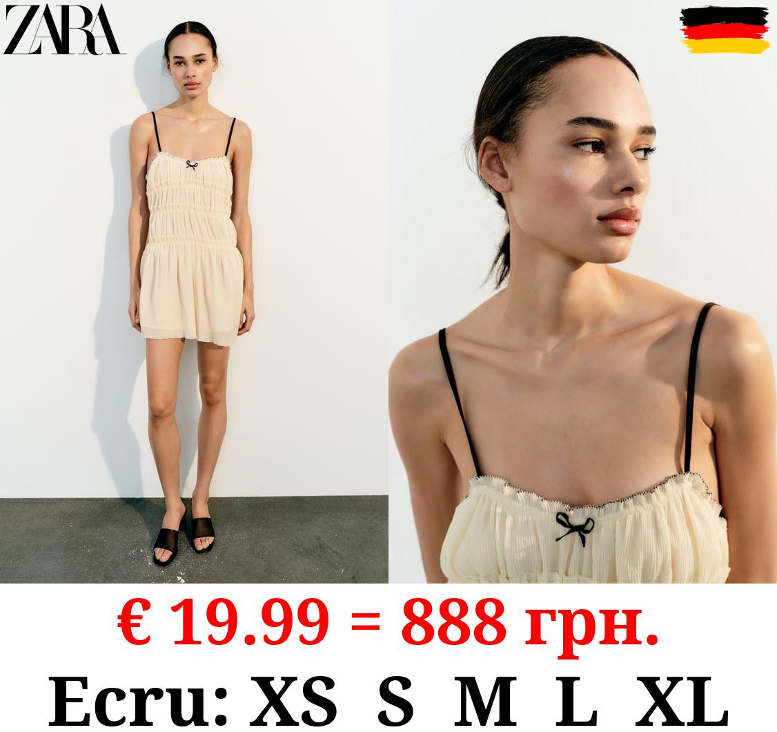 TEXTURED DRESS WITH BOWS