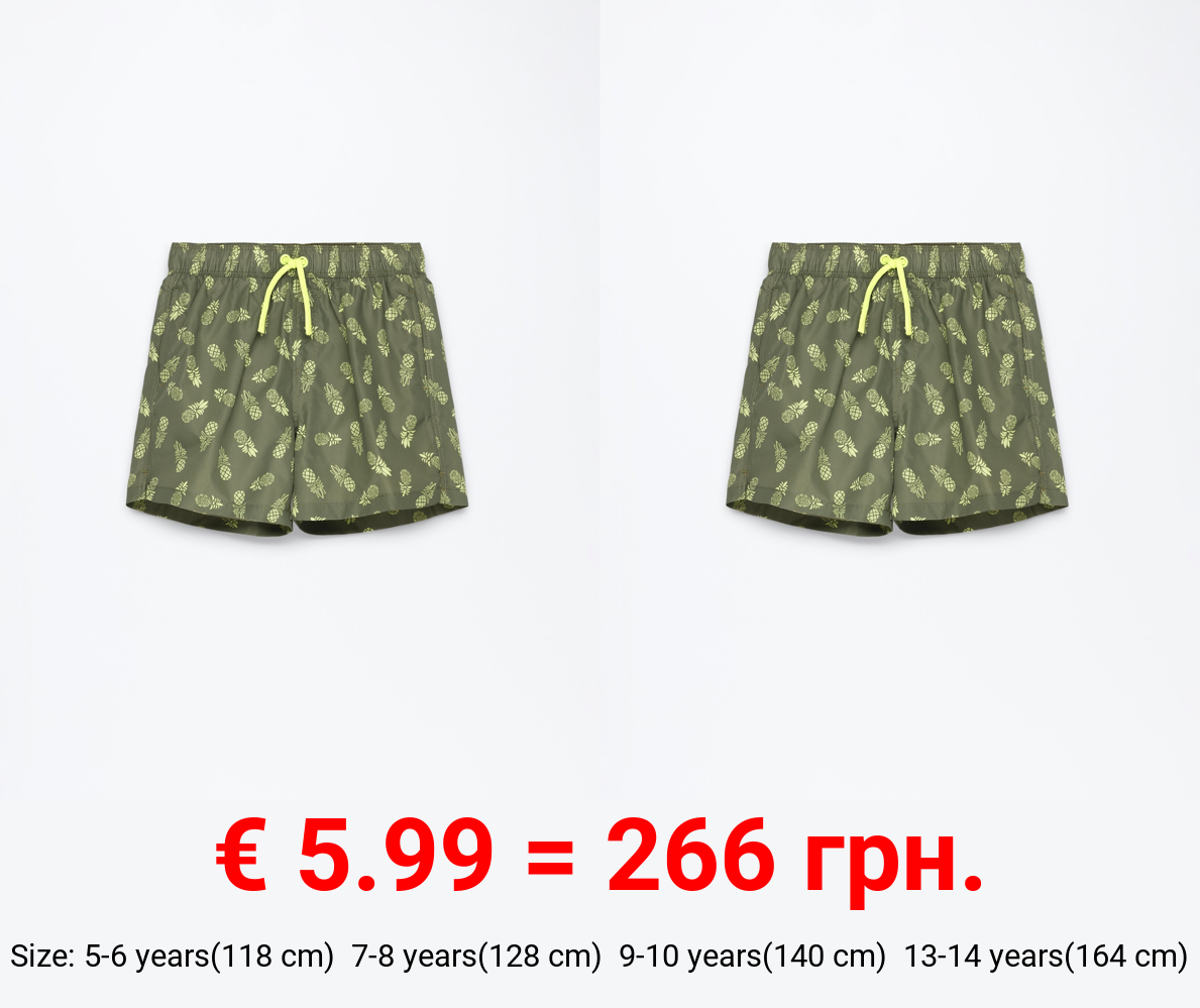 Tropical print swimming trunks