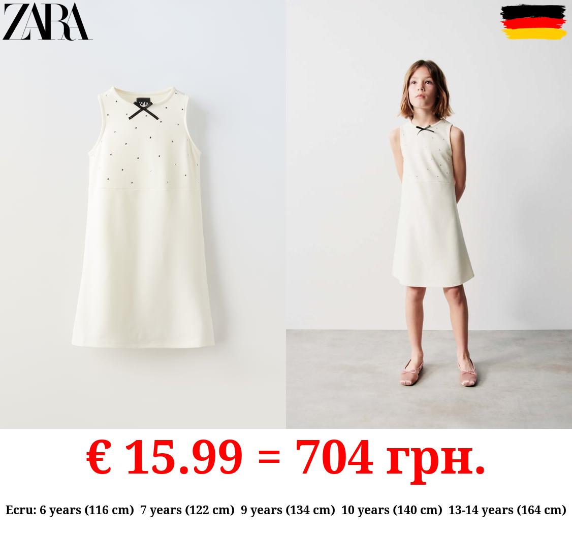 DRESS WITH BOW AND RHINESTONES