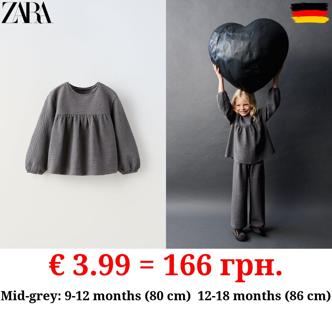 TEXTURED OVERSIZE BLOUSE