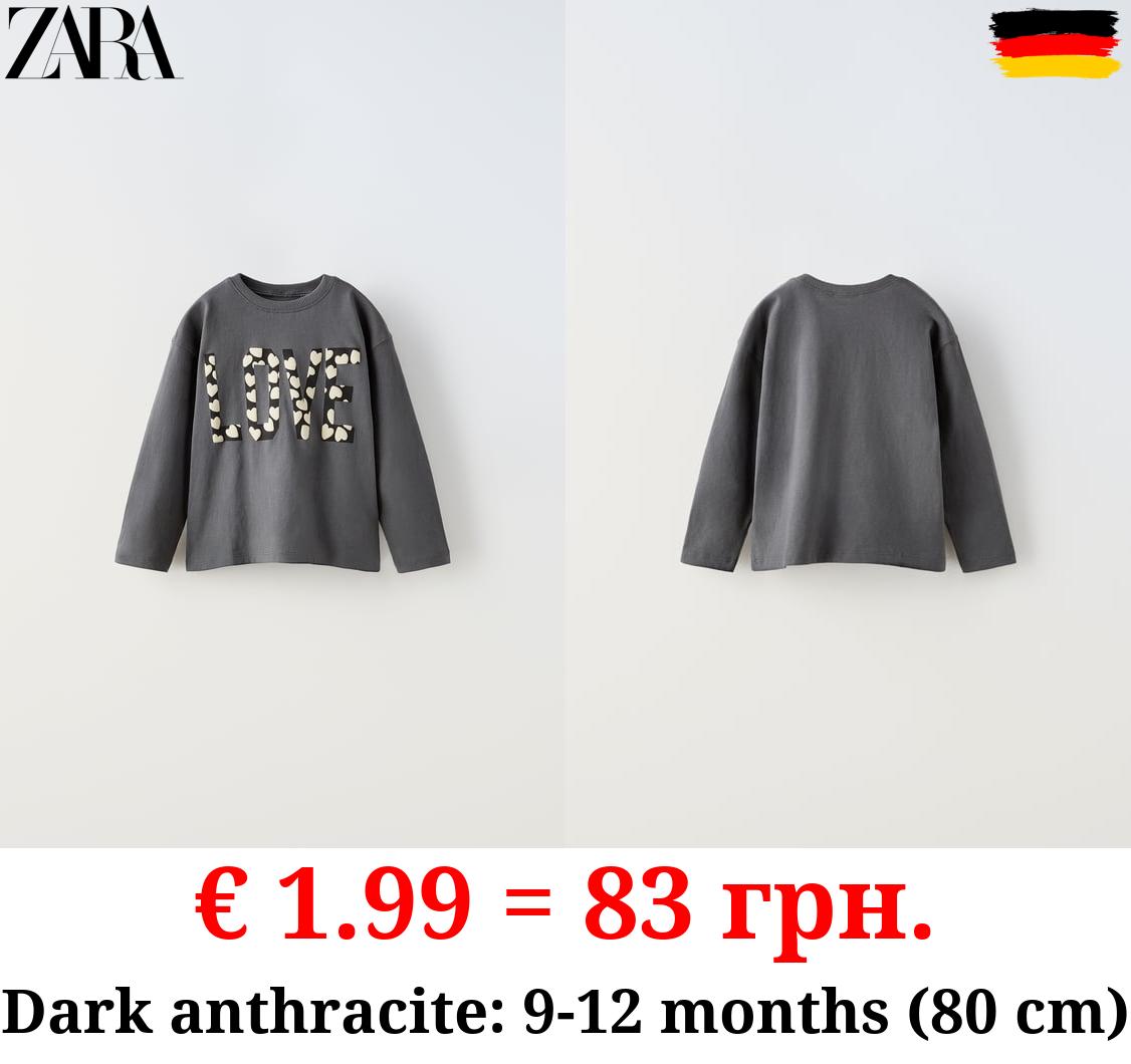 RAISED SLOGAN T-SHIRT