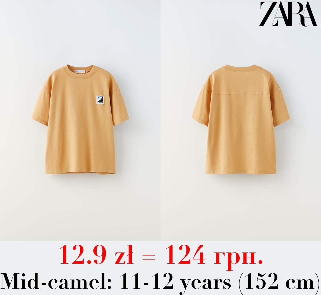 T-SHIRT WITH TAG APPLIQUÉ