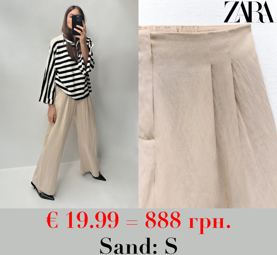 LOOSE FIT PLEATED TROUSERS