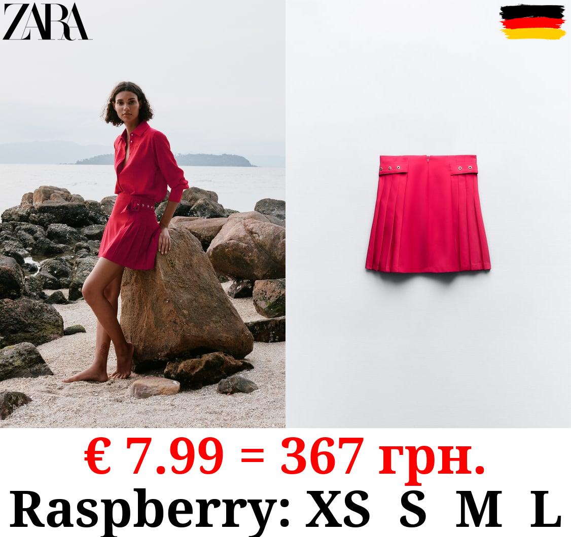 BOX PLEAT MINI SKIRT WITH BUCKLES