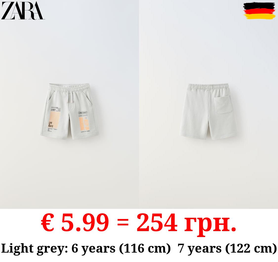 PLUSH BERMUDA SHORTS WITH NEON SLOGANS