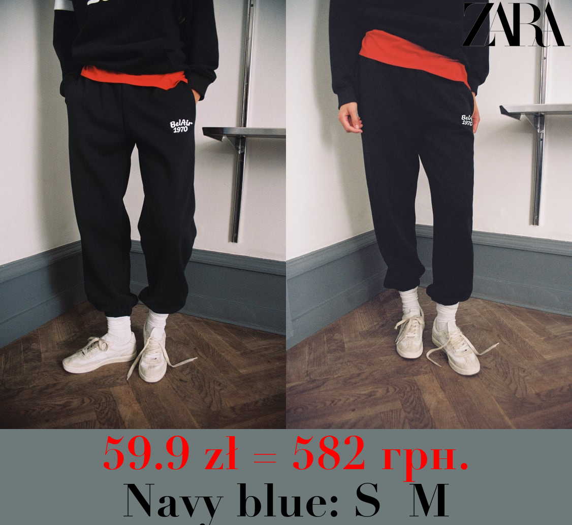 JOGGING TROUSERS WITH EMBROIDERED SLOGAN