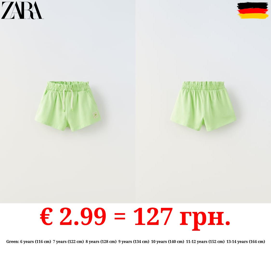 PLUSH BERMUDA SHORTS WITH LABEL DETAIL