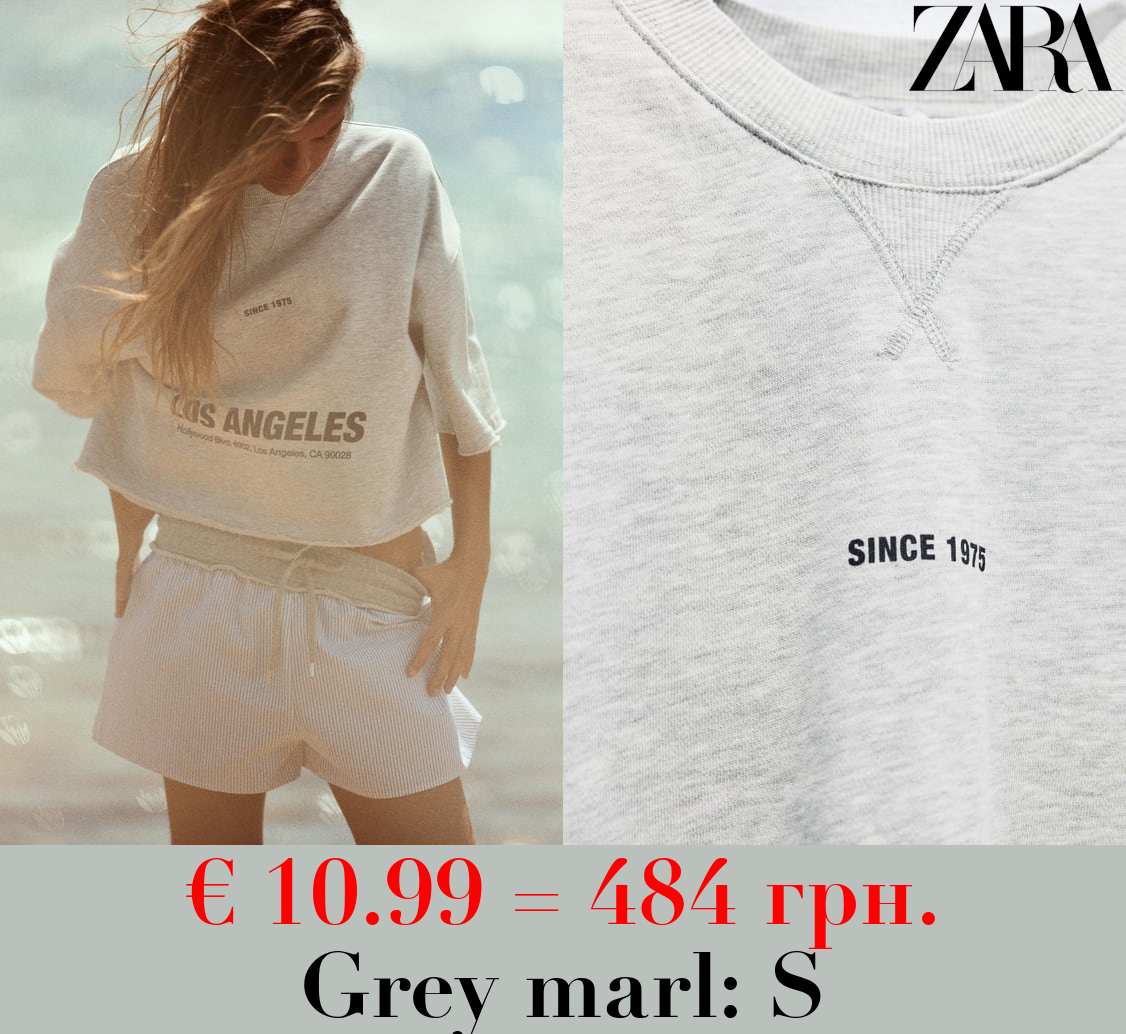 CROPPED SLOGAN SWEATSHIRT