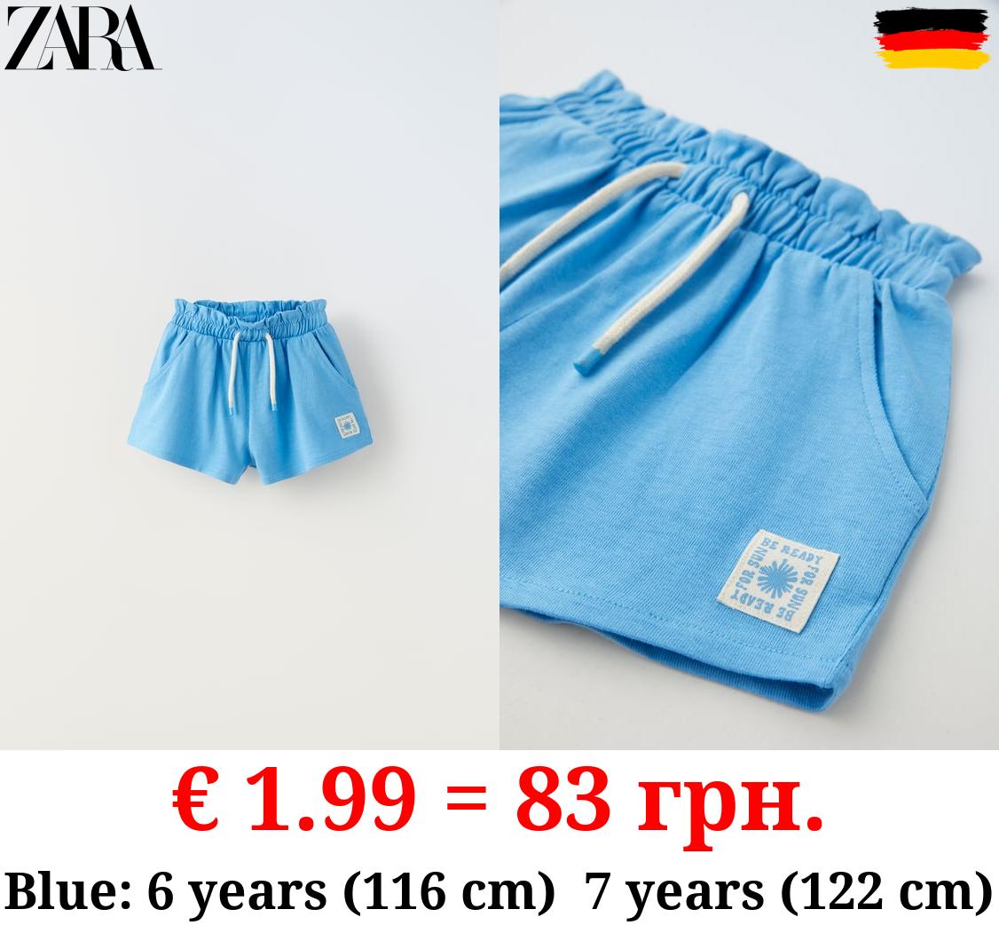 PLUSH BERMUDA SHORTS WITH LABEL DETAIL