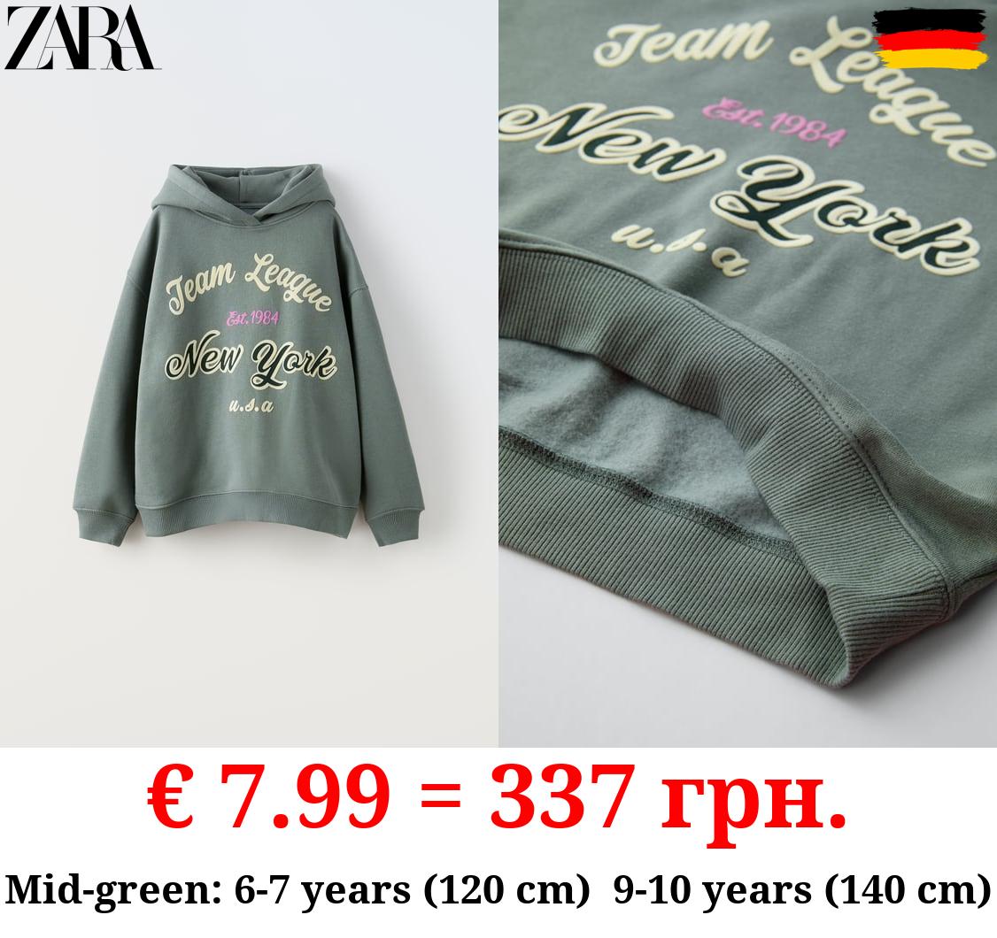 FLOCKED SLOGAN HOODIE