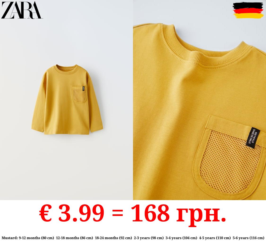 T-SHIRT WITH MESH POCKET