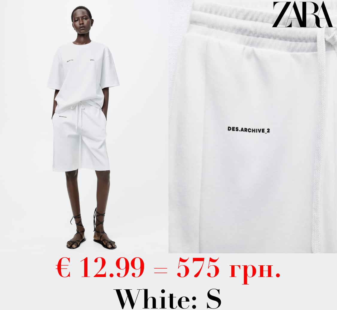 INTERLOCK SLOGAN BERMUDA SHORTS