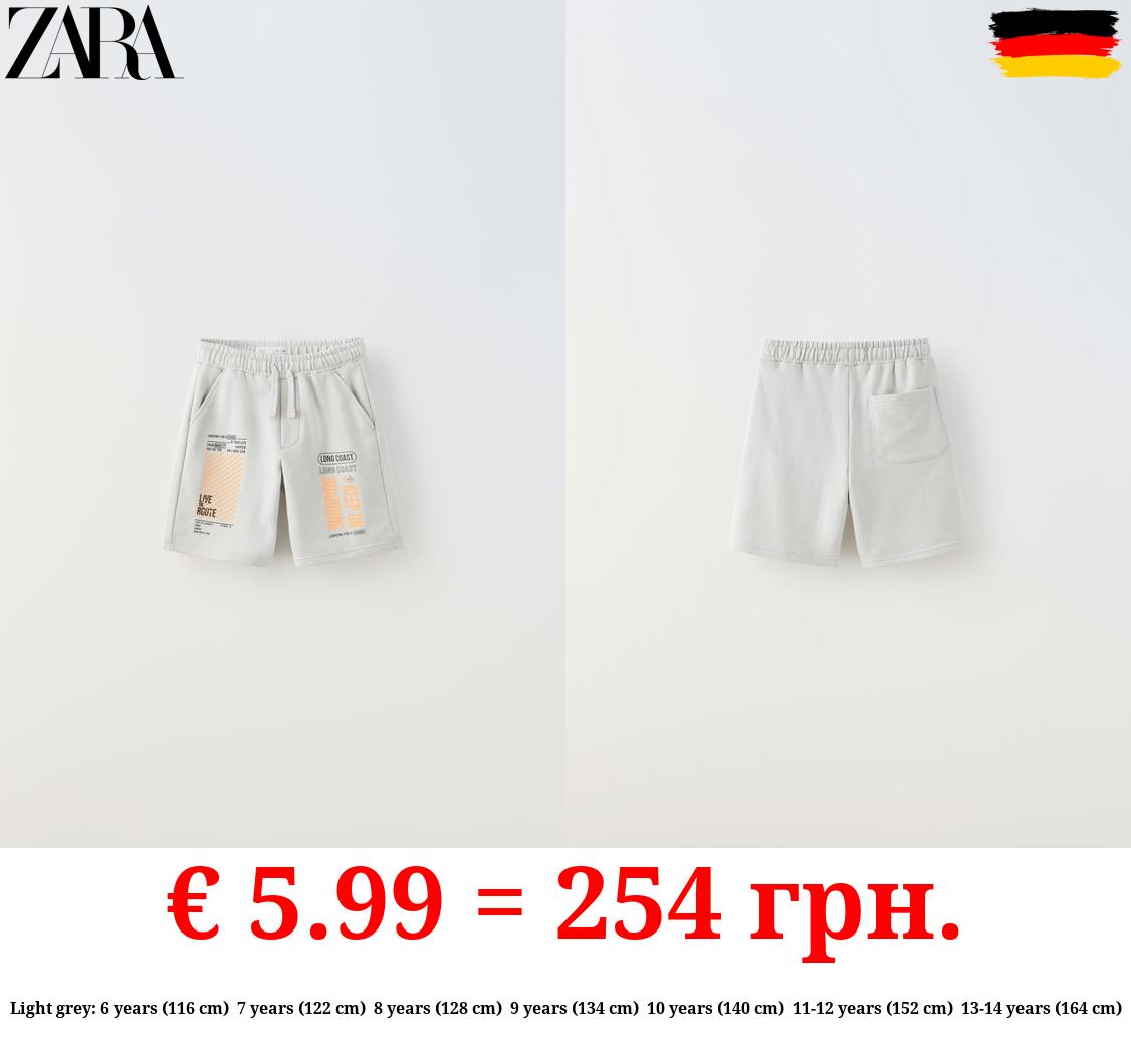 PLUSH BERMUDA SHORTS WITH NEON SLOGANS