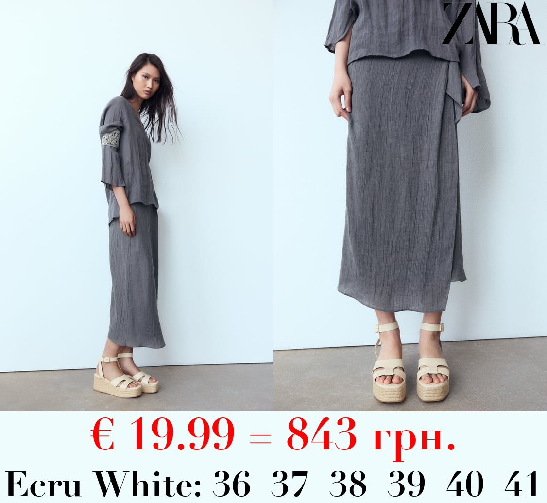 LEATHER WEDGE SANDALS