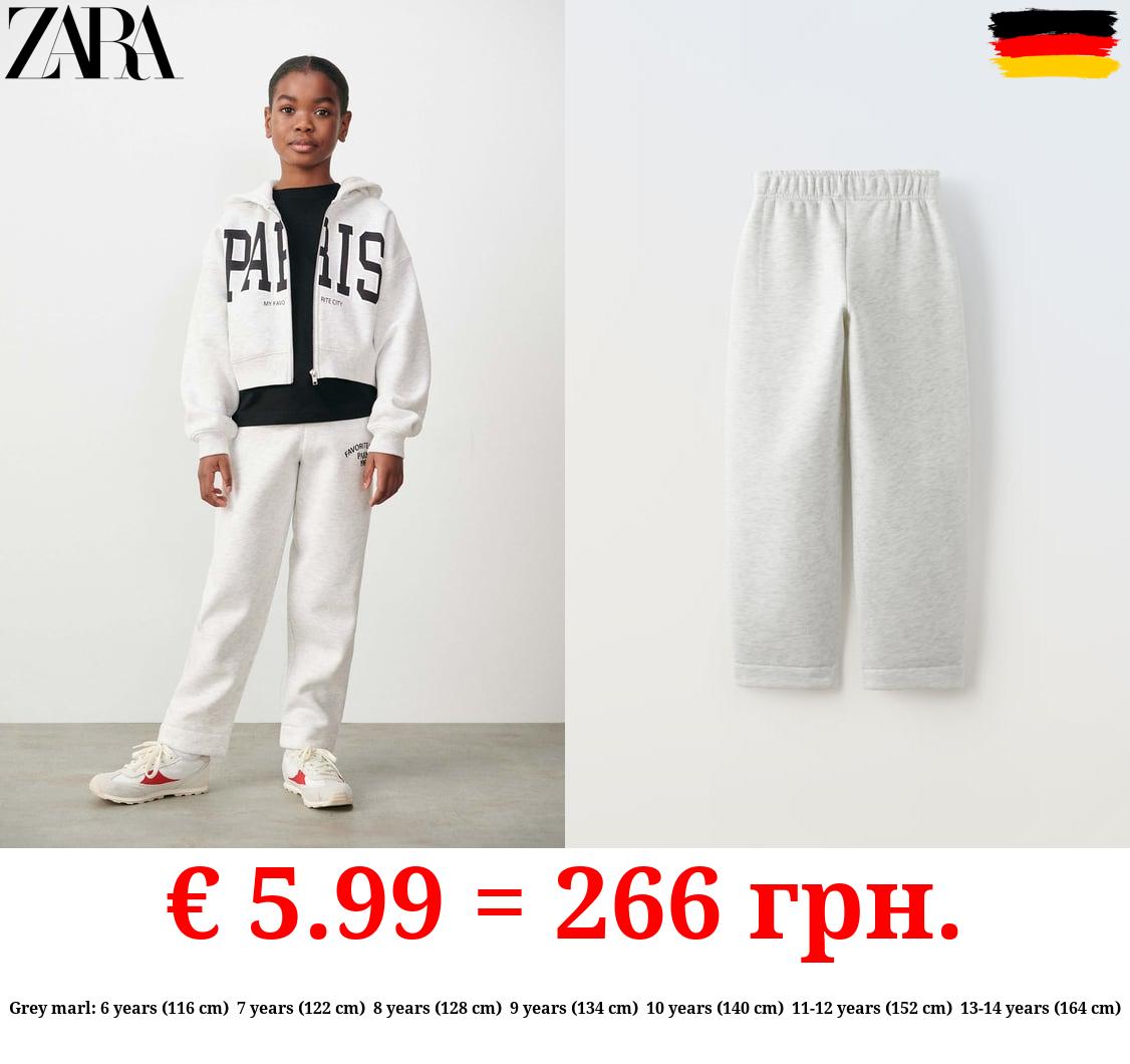 JOGGING TROUSERS WITH SLOGAN