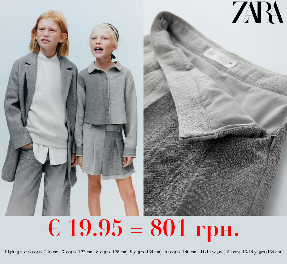 ASYMMETRIC SKIRT WITH FRAYED HEM