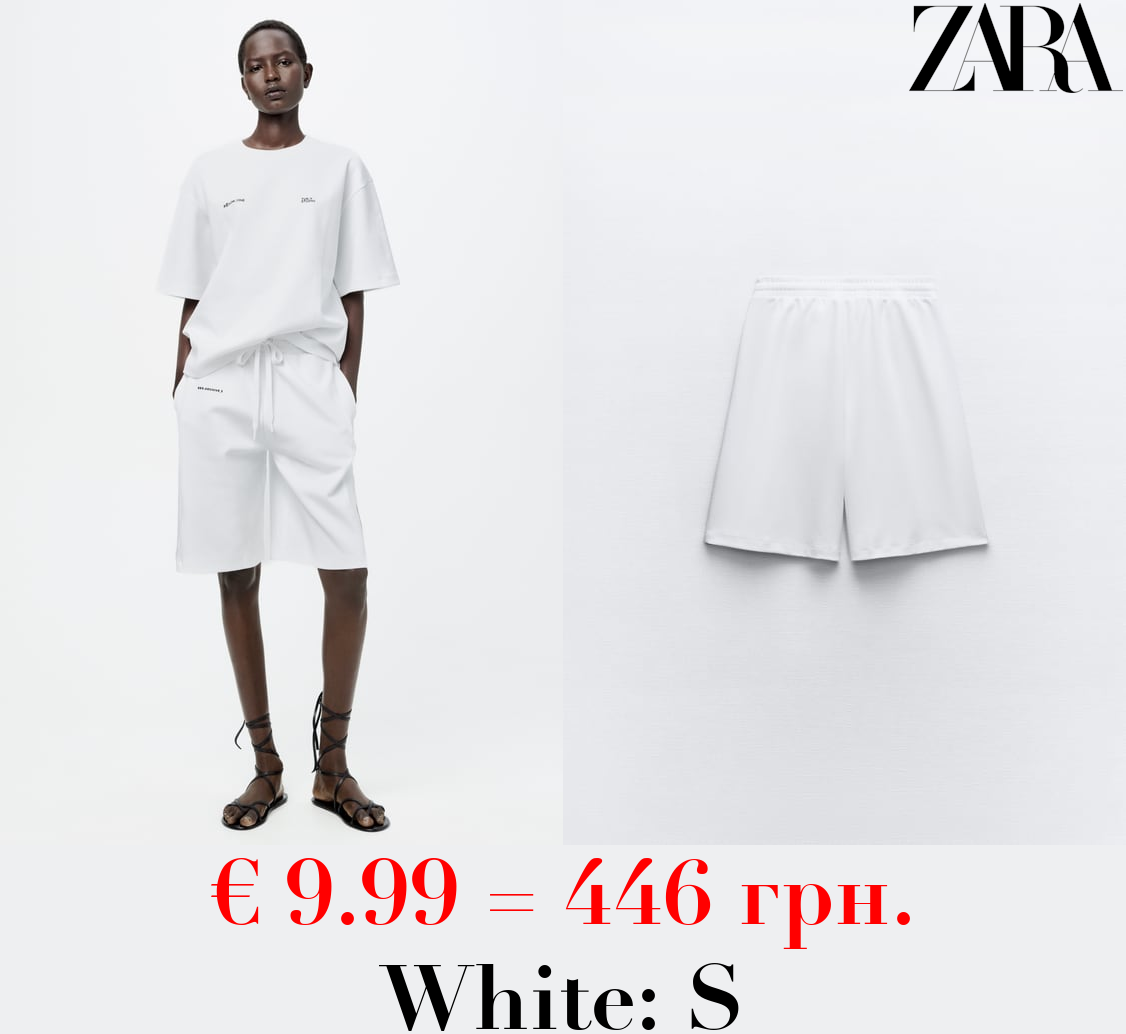 INTERLOCK SLOGAN BERMUDA SHORTS