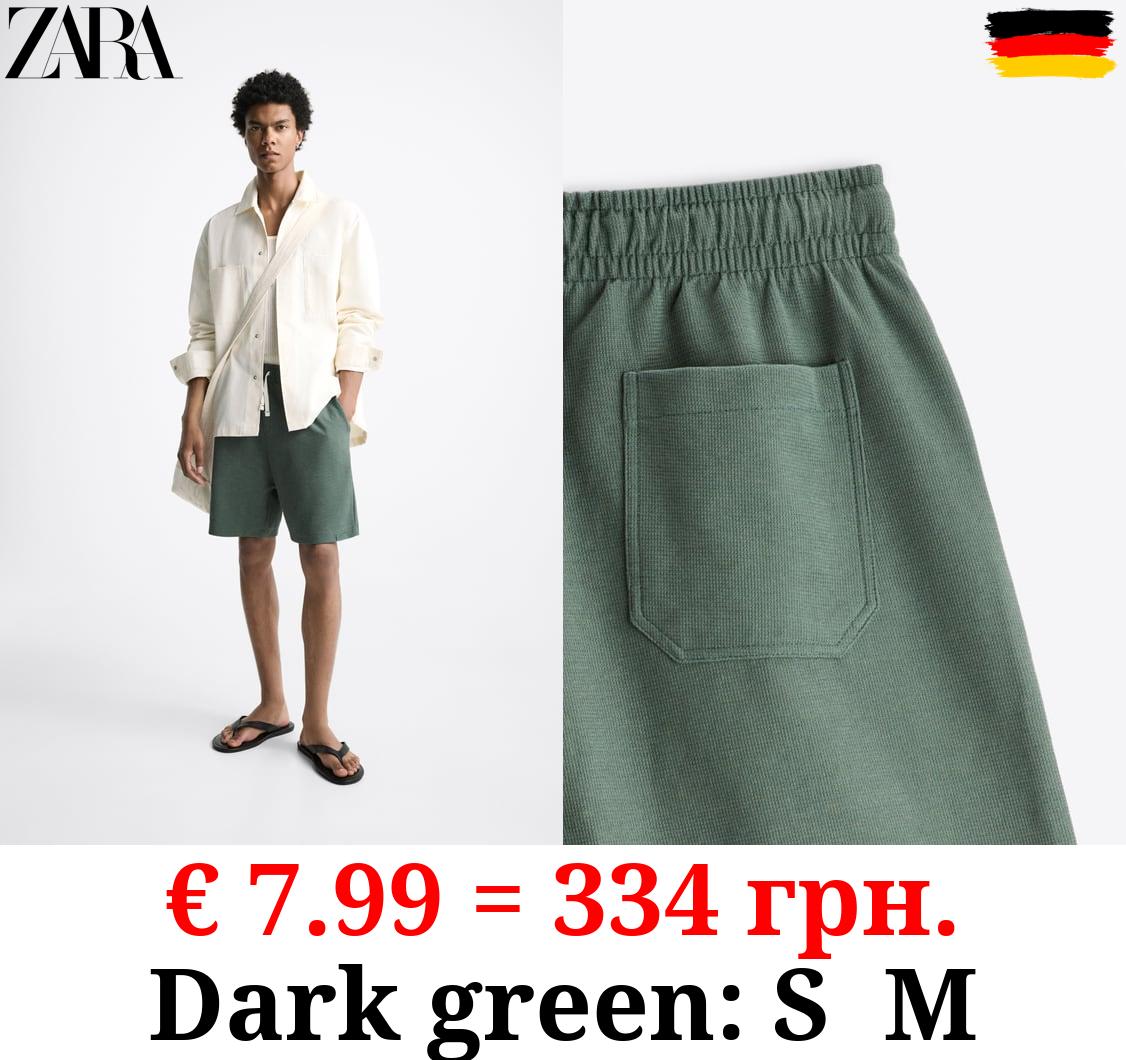 TEXTURED BERMUDA SHORTS WITH LABEL