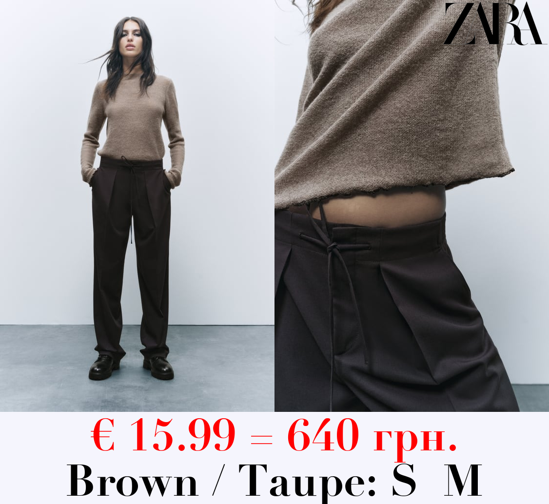 KNIT SWEATER WITH ROLLING TRIMS