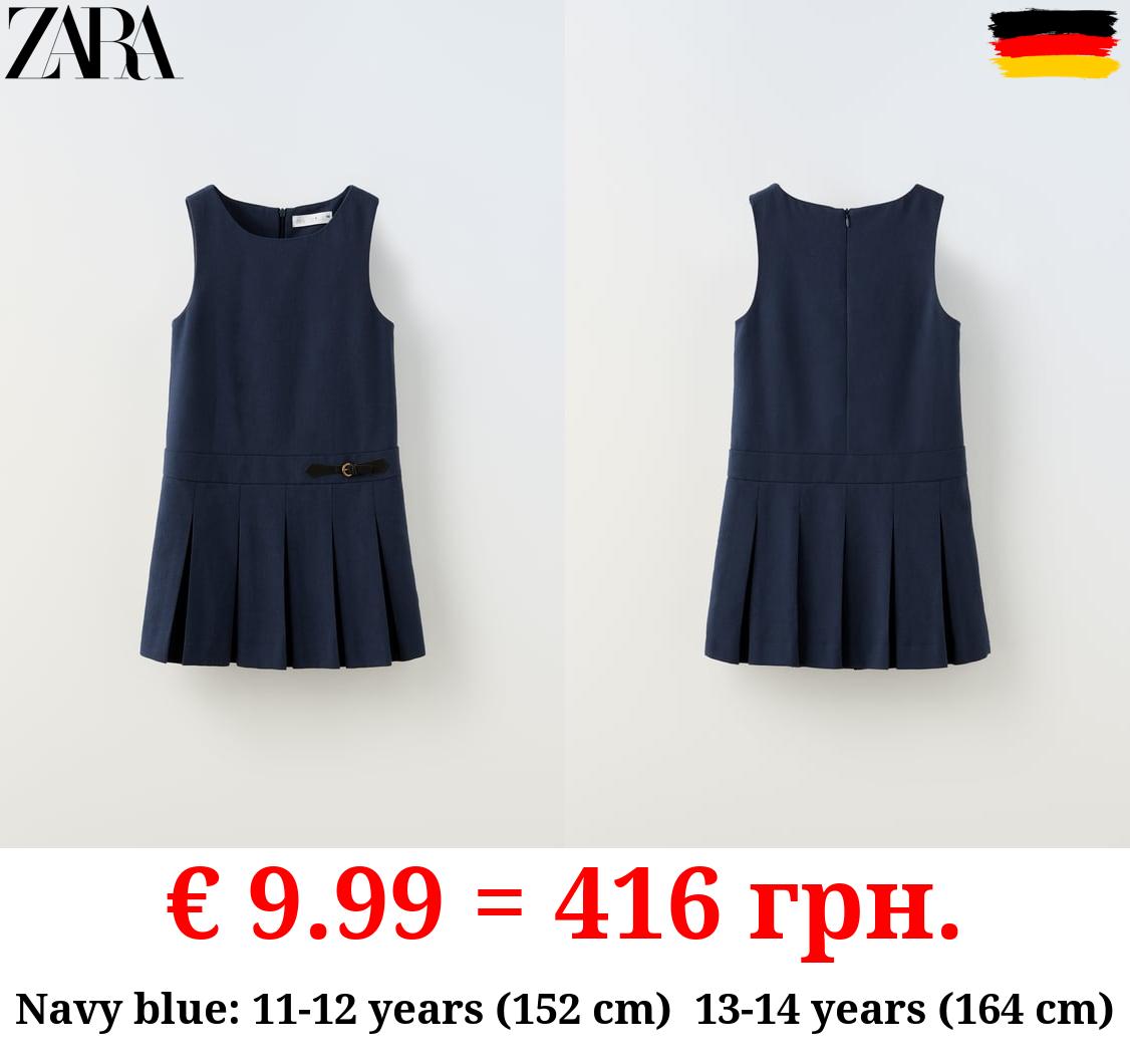 BOX PLEAT PINAFORE DRESS WITH BUCKLE