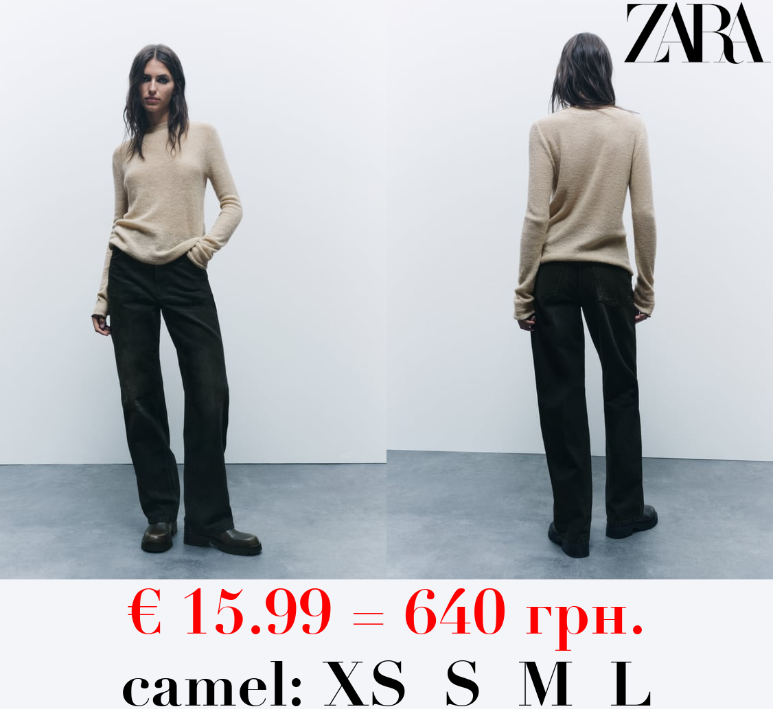 KNIT SWEATER WITH ROLLING TRIMS