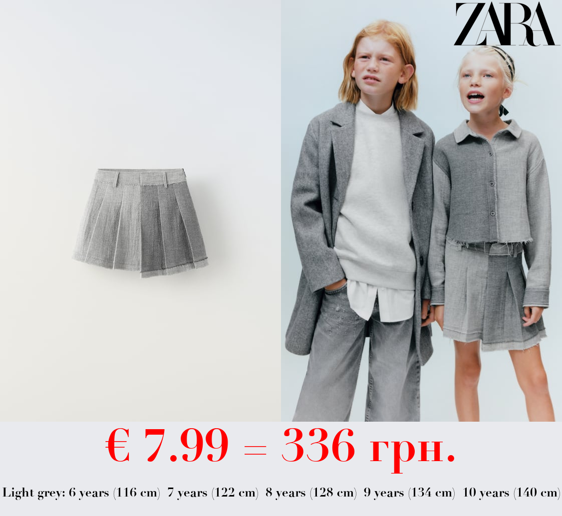 ASYMMETRIC SKIRT WITH FRAYED HEM