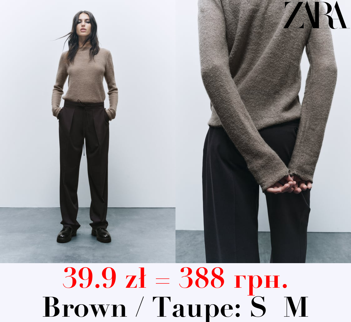 KNIT SWEATER WITH ROLLING TRIMS