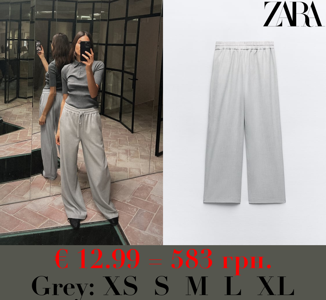 TROUSERS WITH AN ELASTICATED WAISTBAND