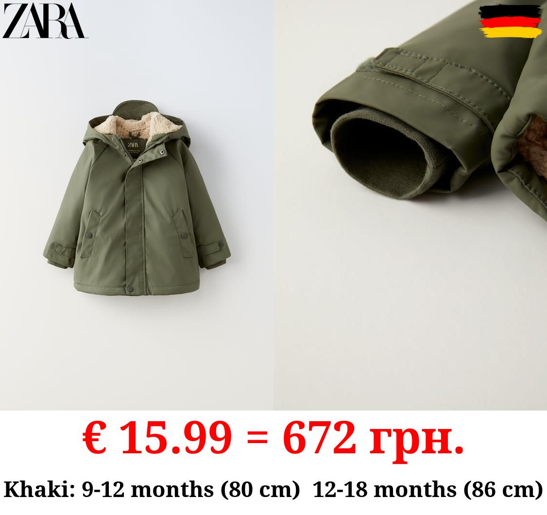 RUBBERISED RAINCOAT WITH FAUX SHEARLING