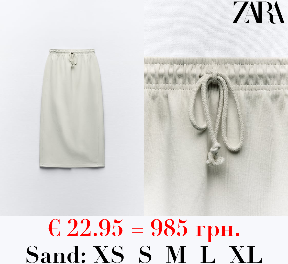 CLEAN INTERLOCK PLUSH MIDI SKIRT