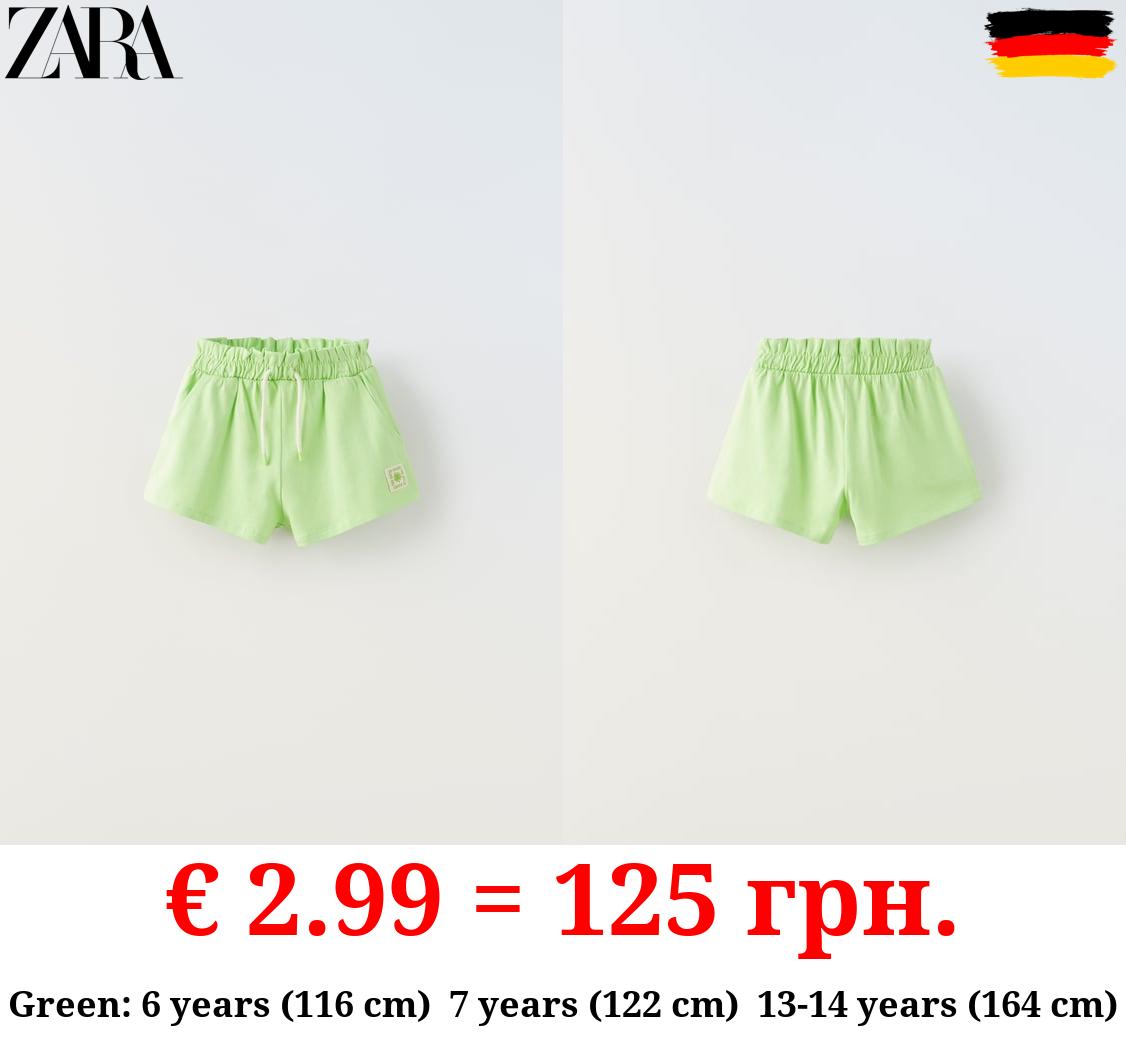 PLUSH BERMUDA SHORTS WITH LABEL DETAIL