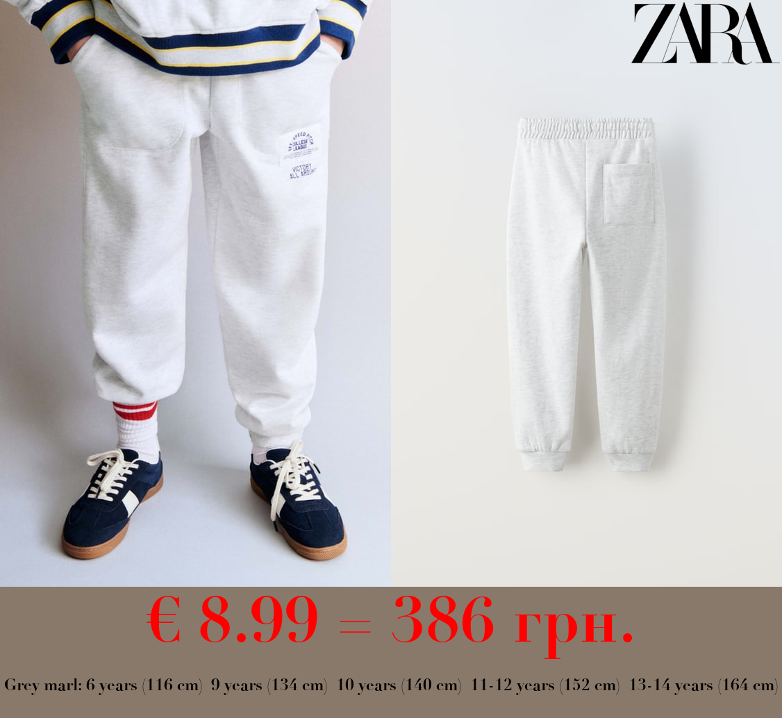 PLUSH TROUSERS WITH LABEL APPLIQUÉ