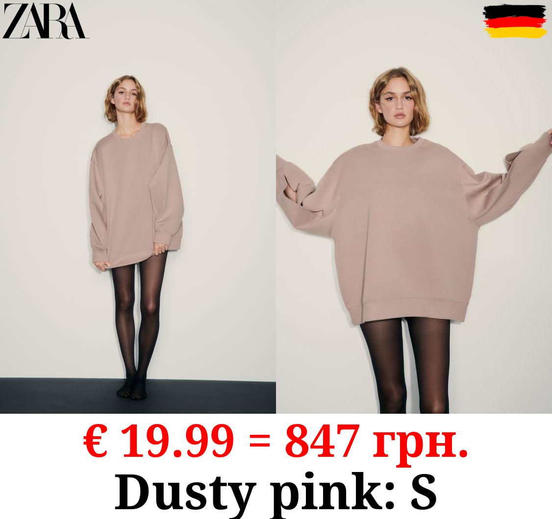 OVERSIZE INTERLOCK SWEATSHIRT WITH OPENING DETAIL