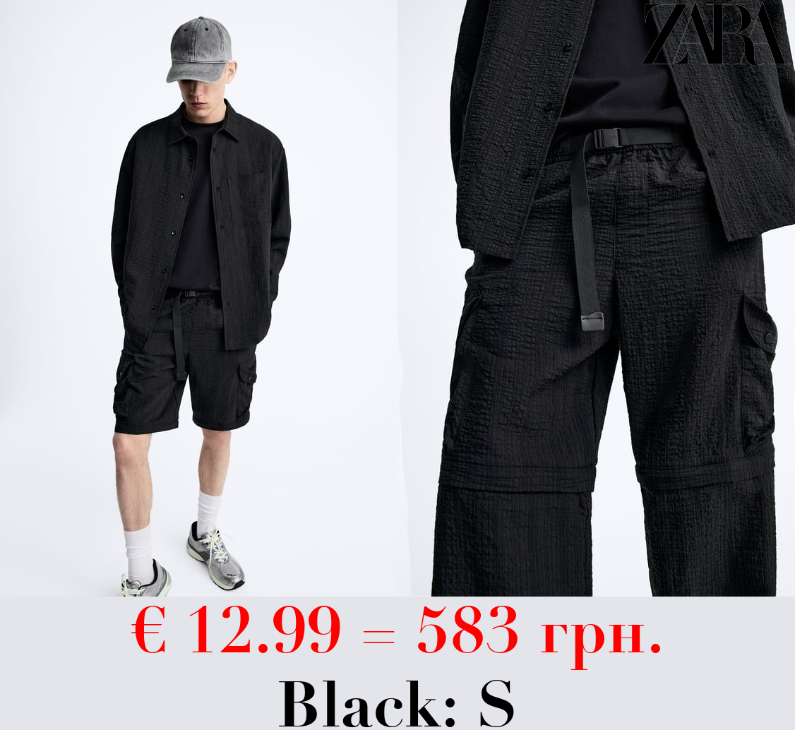 CREASED-EFFECT TROUSERS WITH DETACHABLE DETAIL