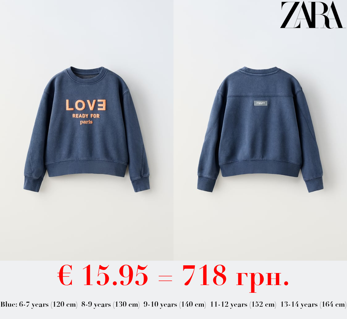 FADED SWEATSHIRT WITH SLOGAN