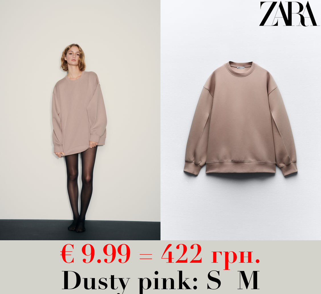 OVERSIZE INTERLOCK SWEATSHIRT WITH OPENING DETAIL