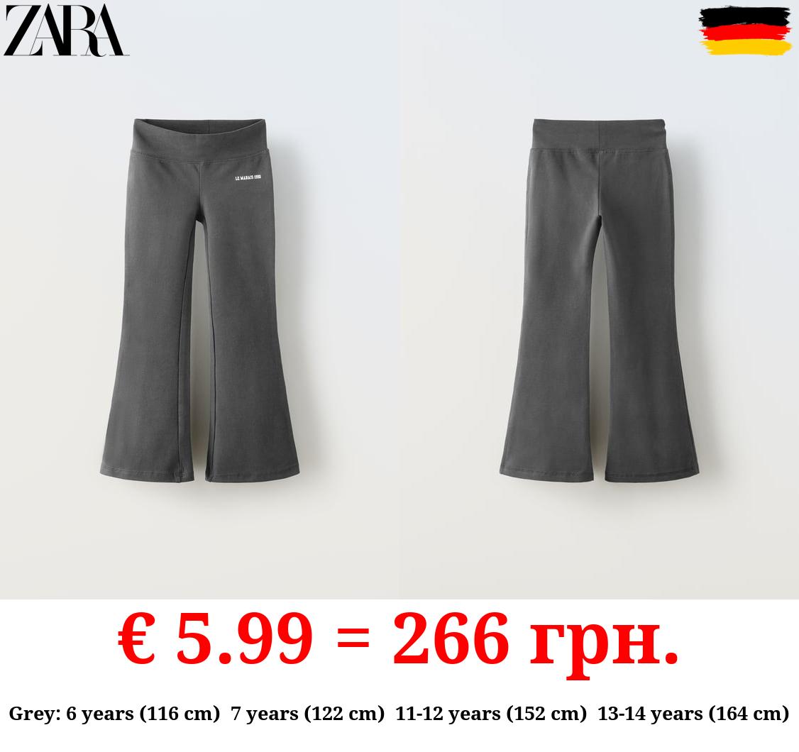 FLARED LEGGINGS WITH SLOGAN