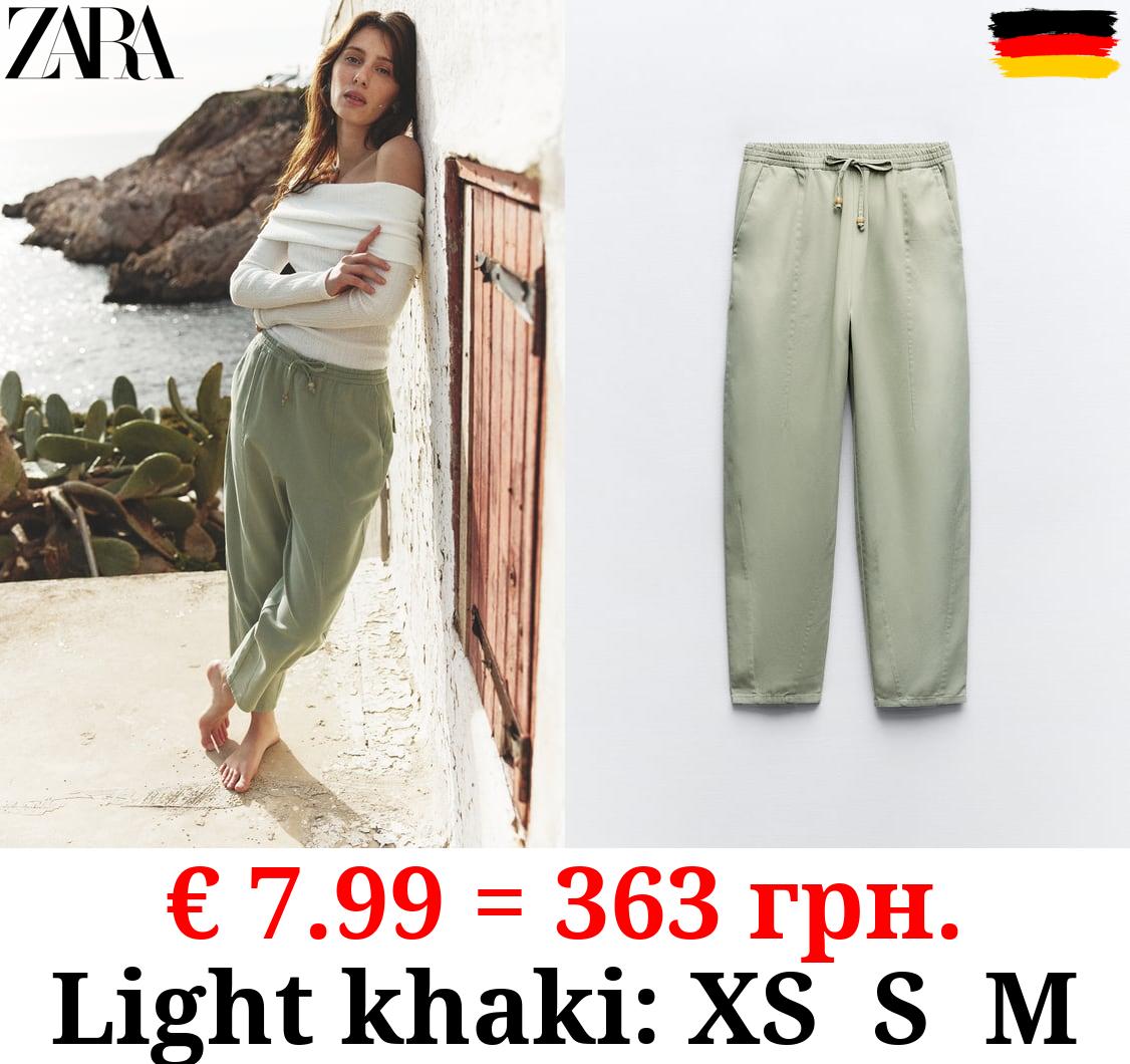 TROUSERS WITH AN ELASTICATED WAISTBAND