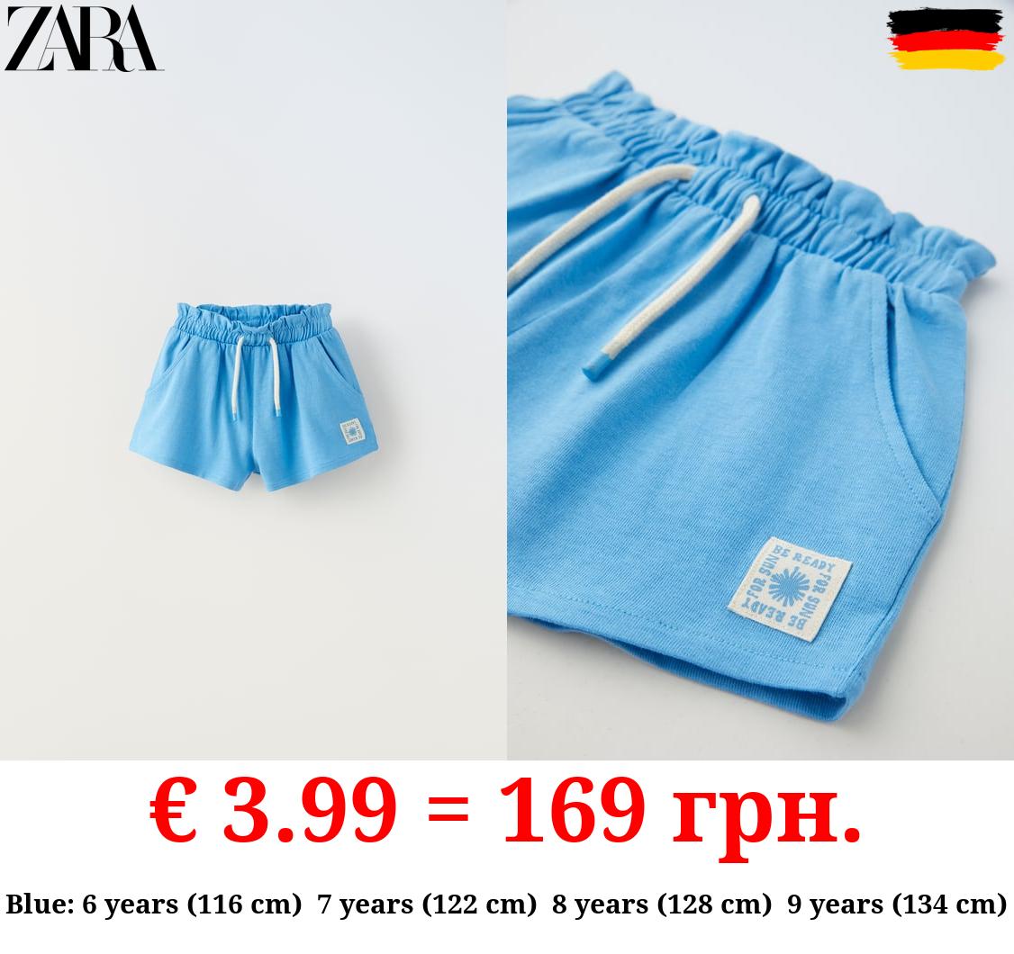 PLUSH BERMUDA SHORTS WITH LABEL DETAIL