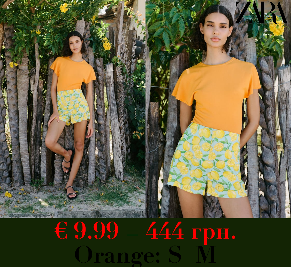 PLAIN KNIT TOP WITH RUFFLED SLEEVES