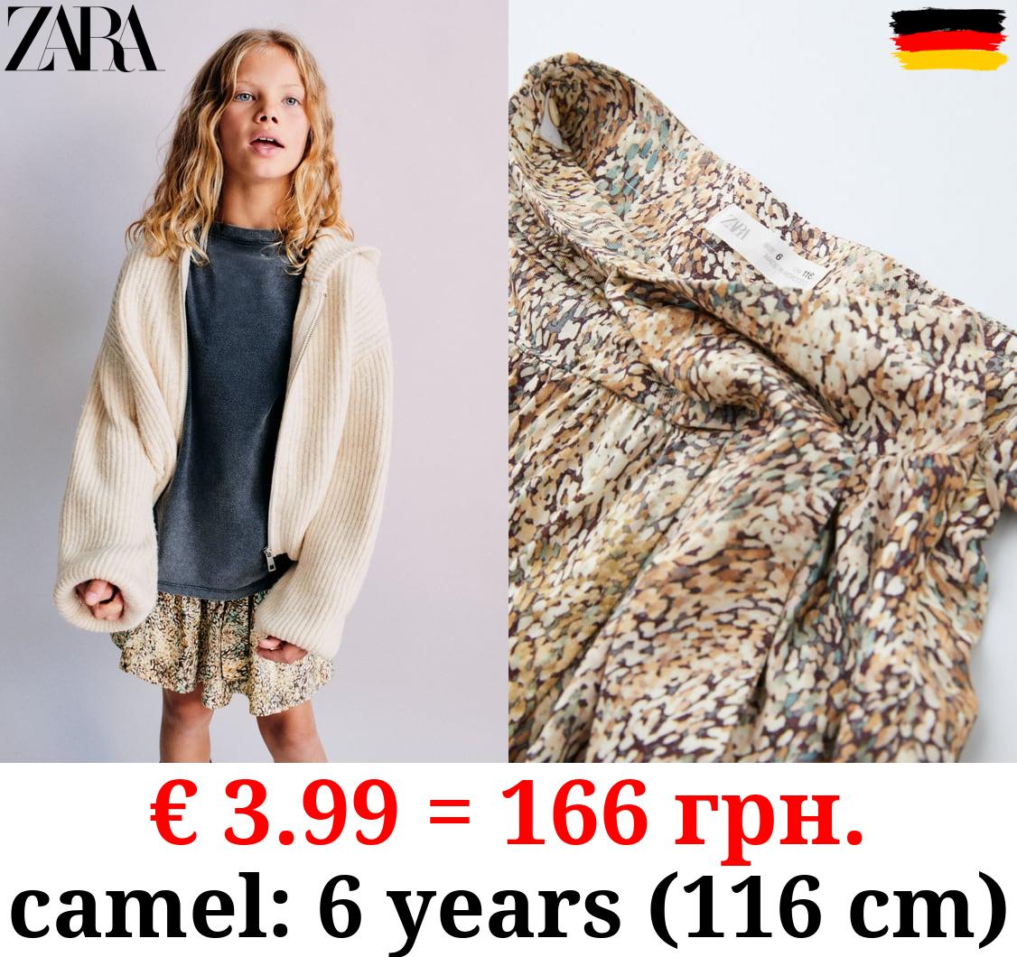 PRINTED SKIRT WITH KNOT DETAIL